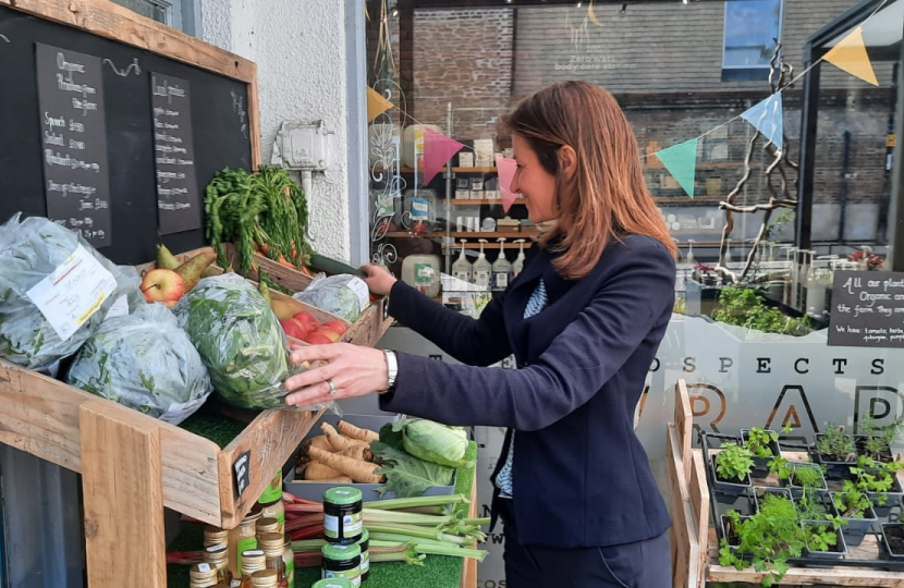 Lucy selecting some vegetables