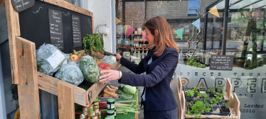 Lucy selecting some vegetables